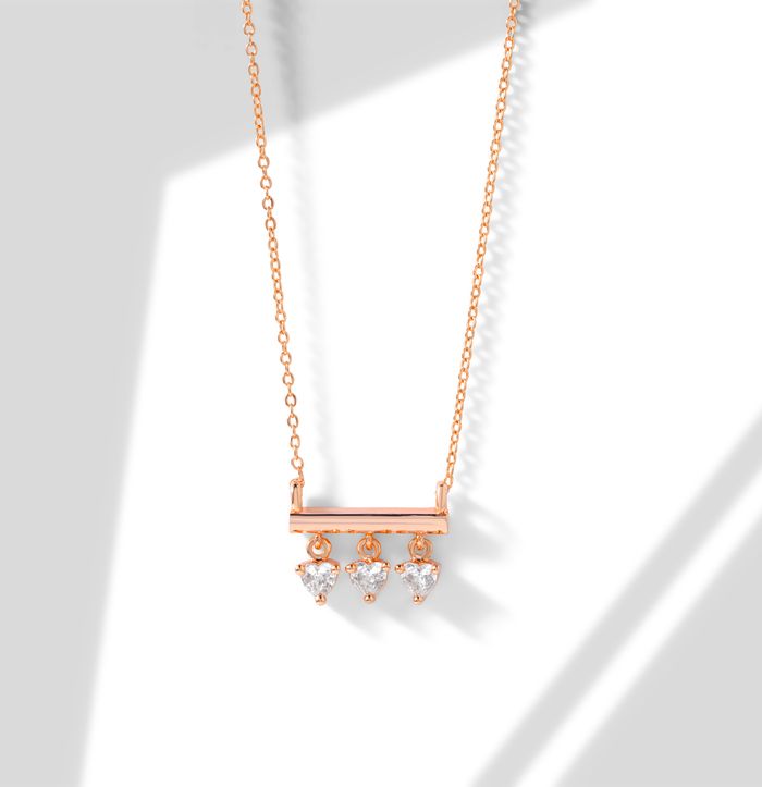 Minimalist diamond necklace displayed elegantly with subtle shadows.